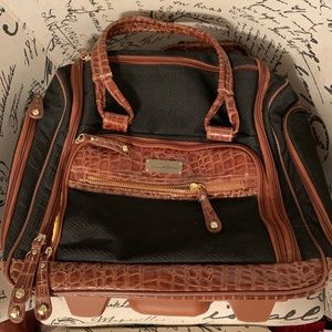 Samantha Brown rolling under seater travel bag